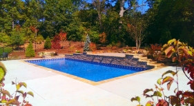 St.-Charles-County-raised-wall-scupper-water-feature-stacked-stone-coping-multi-tiered-deck