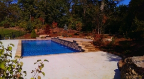 St.-Charles-County-rectangle-pool-with-water-feature-copper-scupper-fall-colors-stacked-stone-coping