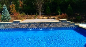 Wentzville-raised-wall-stacked-stone-coping-scupper-water-feature-pillar-steps