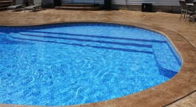 Leisure-shelf-tanning-shelf-large-top-step-stamped-concrete-deck-Wildwood-St-Louis-County