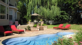 Paver-upper-deck-stamped-concrete-lower-deck-viking-fiberglass-pool-sapphire-blue