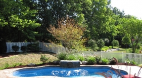 Seamless-slate-stamped-concrete-deck-sheer-decent-waterfall-water-feature-freeform