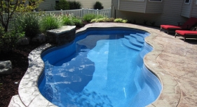 Viking-fiberglass-Cancun-steps-benches-sapphire-blue-stamped-concrete-sheer-decent